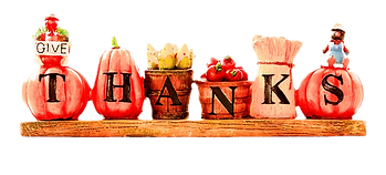 'THANKS' spelled out on pumpkins and baskets on a shelf.